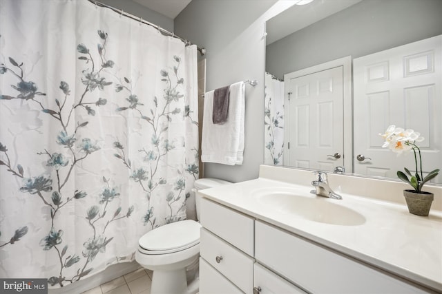 bathroom with toilet, vanity, a shower with shower curtain, and tile patterned floors