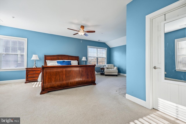 bedroom featuring baseboards, vaulted ceiling, and carpet flooring