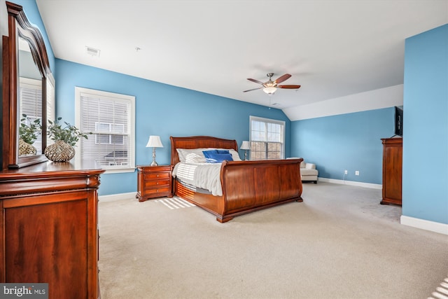 bedroom with lofted ceiling, carpet, visible vents, and baseboards