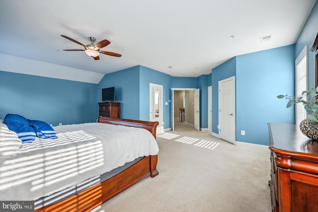 bedroom featuring lofted ceiling, carpet floors, visible vents, and baseboards