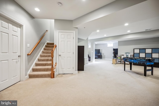 recreation room with recessed lighting, baseboards, and light colored carpet