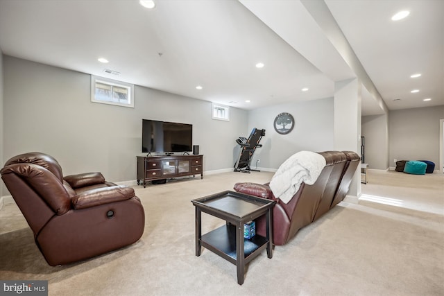 living area with light colored carpet, visible vents, baseboards, and recessed lighting