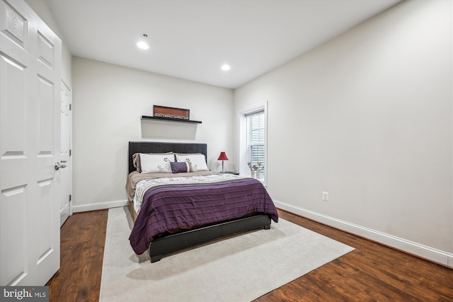 bedroom featuring recessed lighting, wood finished floors, and baseboards