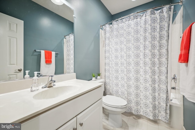 bathroom featuring toilet, tile patterned flooring, and vanity