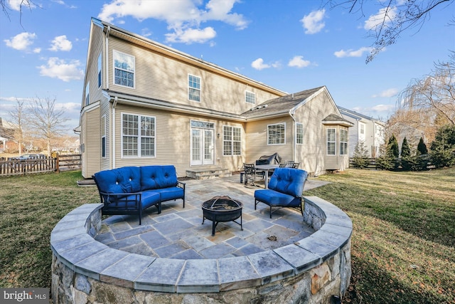 rear view of house featuring entry steps, a lawn, a patio area, and fence