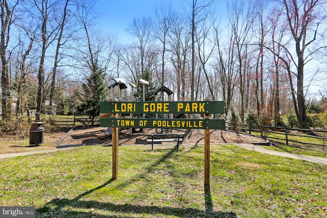 view of play area featuring fence and a lawn