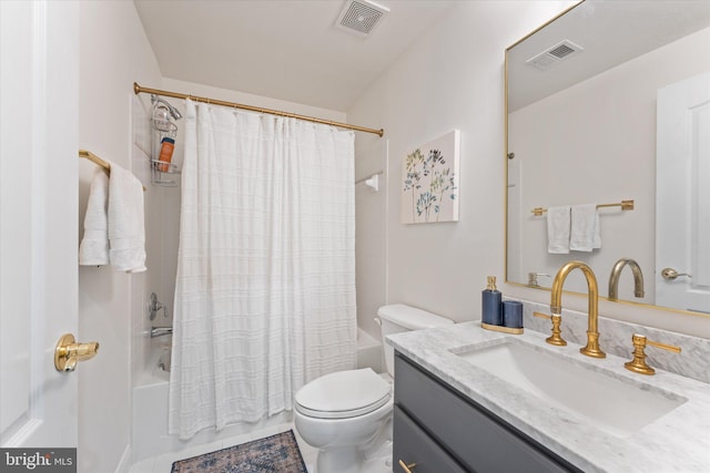 bathroom featuring toilet, visible vents, shower / bath combo with shower curtain, and vanity