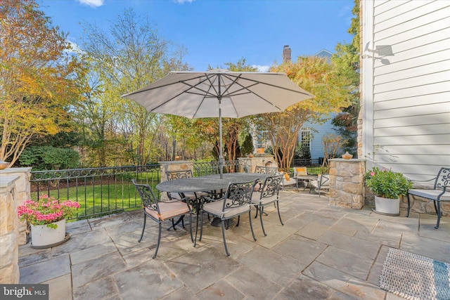 view of patio / terrace with outdoor dining space and fence