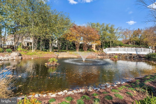 surrounding community featuring a water view