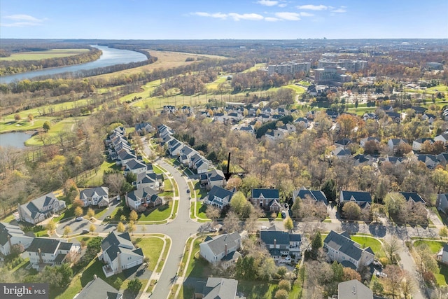 drone / aerial view featuring a water view and a residential view