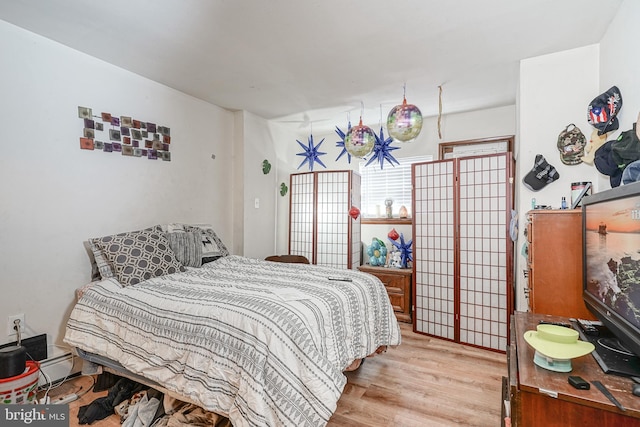 bedroom featuring light wood-type flooring