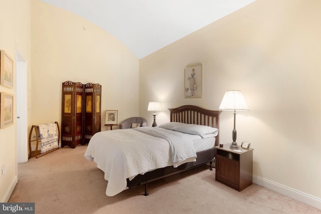 bedroom featuring high vaulted ceiling, light colored carpet, and baseboards