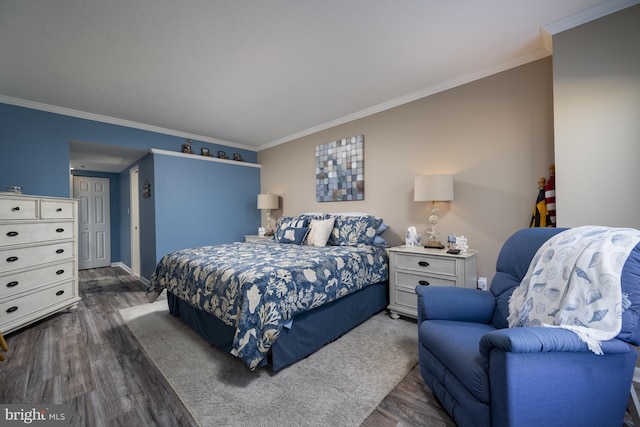 bedroom with dark wood-style flooring and crown molding