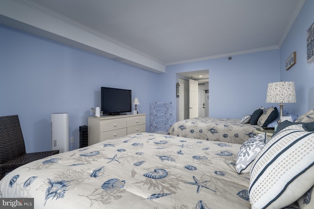 bedroom featuring crown molding