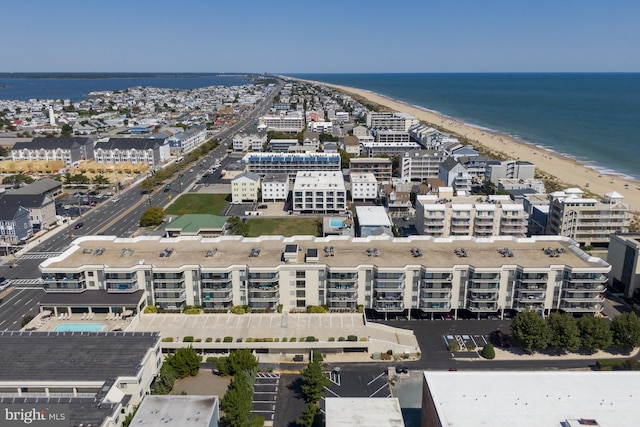 aerial view featuring a view of city, a water view, and a view of the beach