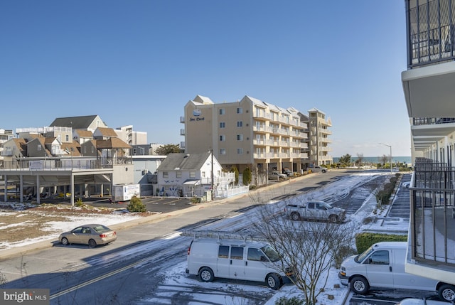 view of building exterior featuring uncovered parking