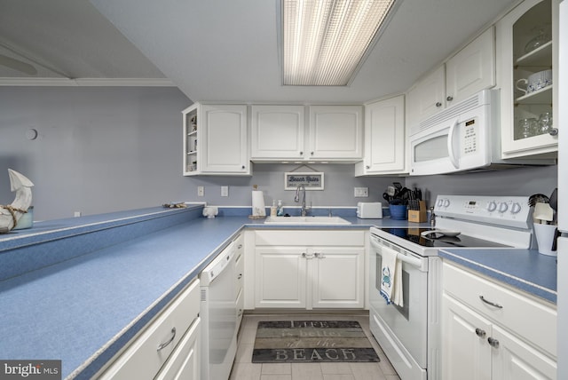 kitchen with crown molding, glass insert cabinets, white cabinets, a sink, and white appliances