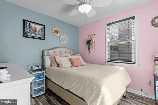 bedroom with ceiling fan, baseboards, and dark wood-style flooring