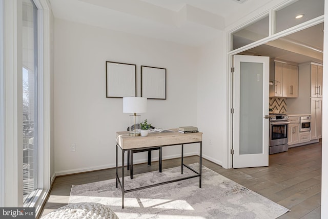 office featuring recessed lighting, wood finished floors, and baseboards