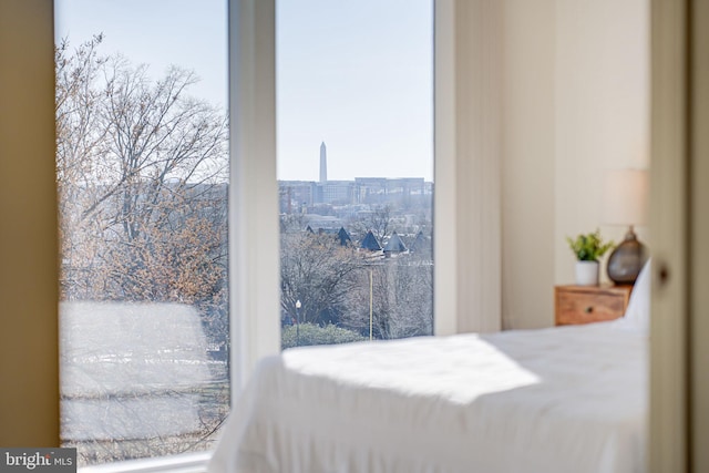 bedroom featuring a city view