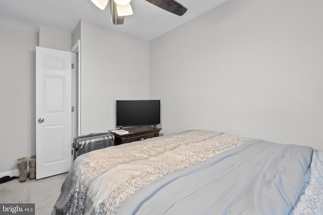 bedroom with a ceiling fan, carpet flooring, and baseboards