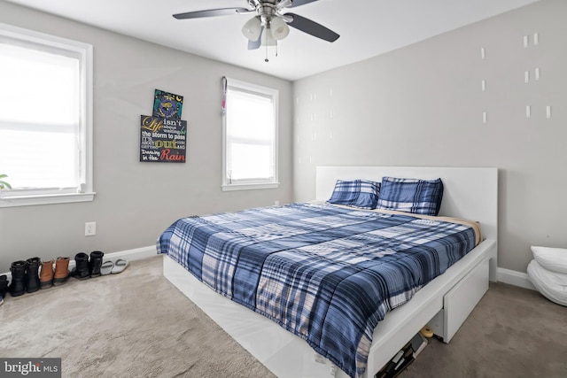 bedroom featuring ceiling fan, carpet flooring, and baseboards