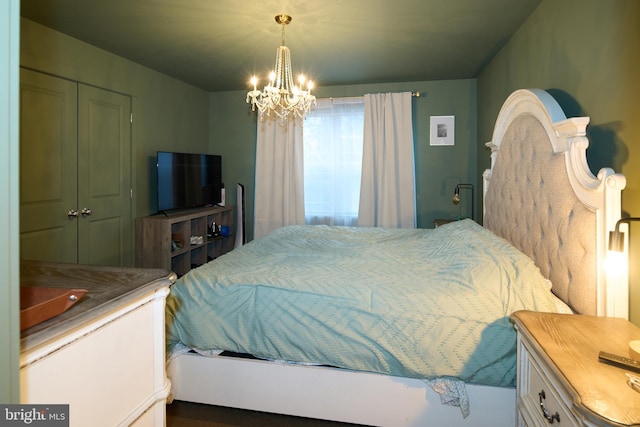 bedroom with a chandelier