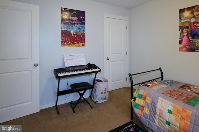 bedroom with dark colored carpet