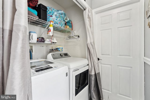 laundry area featuring laundry area and independent washer and dryer