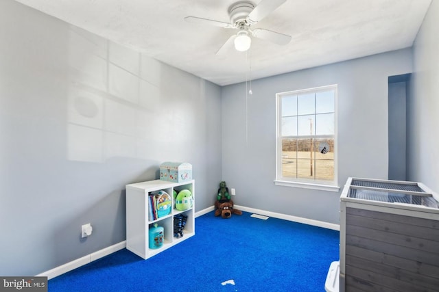 playroom with carpet flooring, ceiling fan, and baseboards