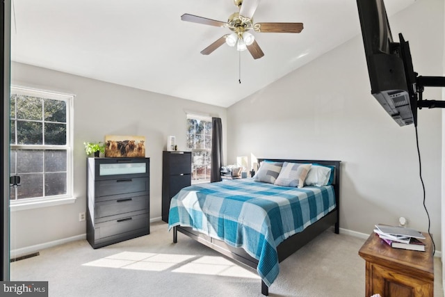 bedroom featuring carpet floors, visible vents, vaulted ceiling, ceiling fan, and baseboards