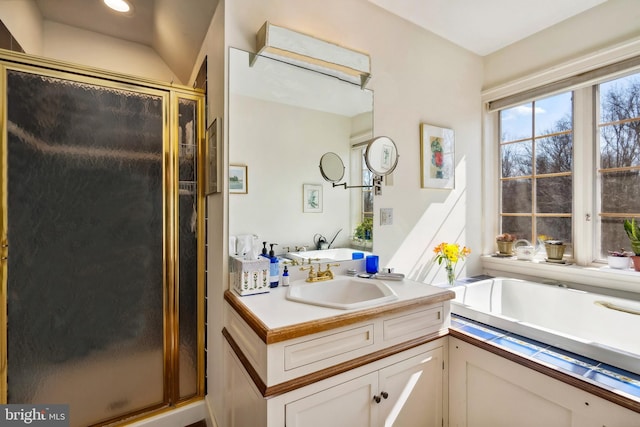 full bathroom featuring a stall shower, vanity, and recessed lighting