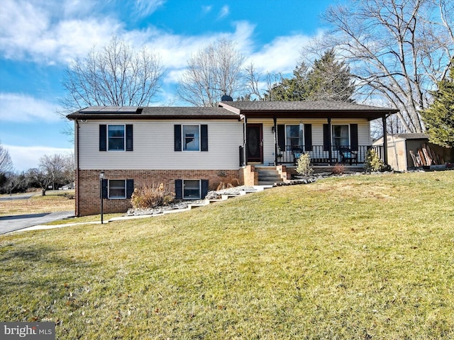 view of front of property with roof mounted solar panels, brick siding, and a front yard