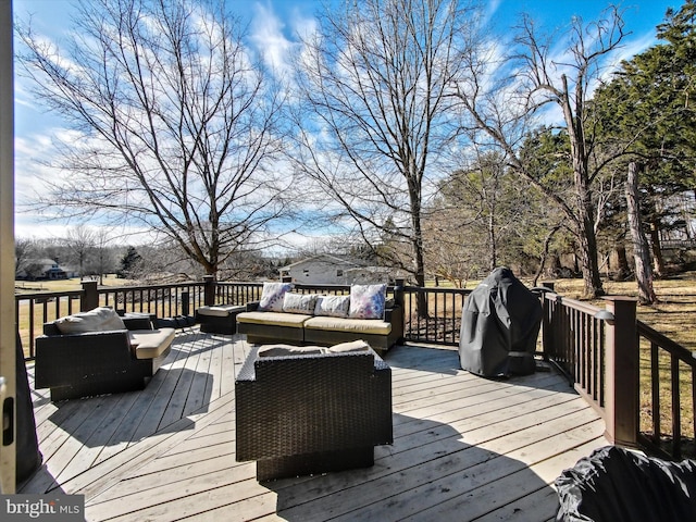 wooden terrace featuring an outdoor living space