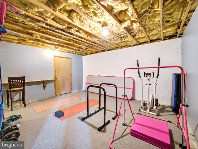 workout room with concrete block wall