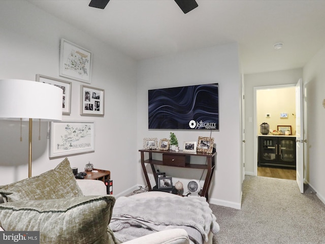 carpeted bedroom featuring ceiling fan and baseboards