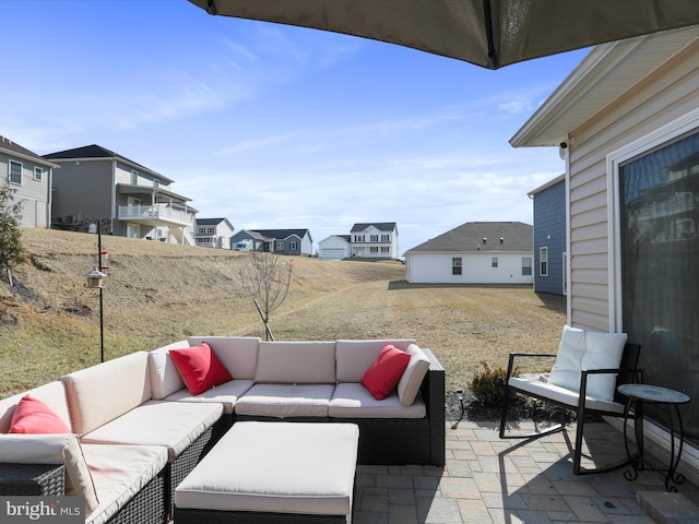 view of patio / terrace with a residential view and an outdoor living space