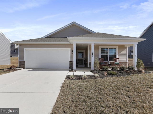 view of front of home with covered porch, concrete driveway, a shingled roof, and an attached garage