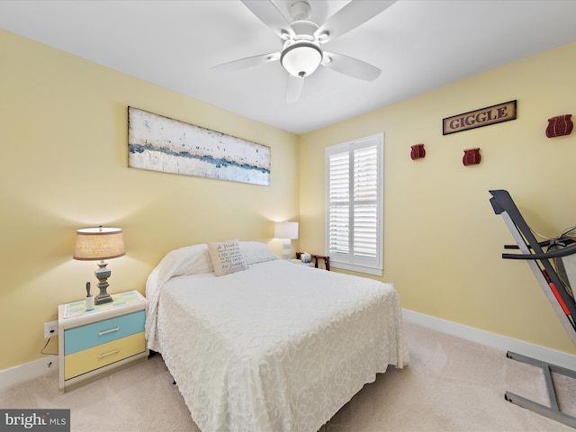 bedroom featuring light carpet, ceiling fan, and baseboards