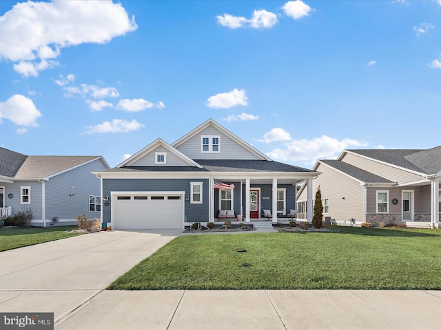 view of front of property featuring covered porch, an attached garage, a front lawn, and concrete driveway