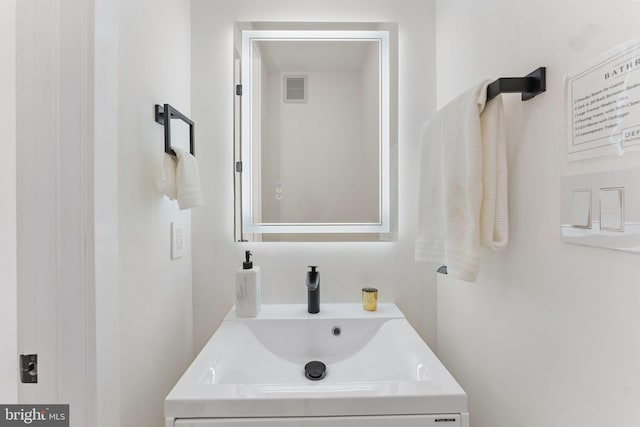 bathroom with visible vents and vanity