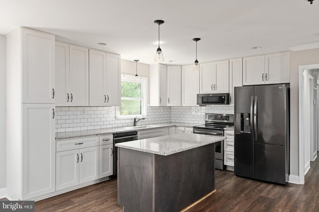 kitchen featuring stainless steel appliances and white cabinets