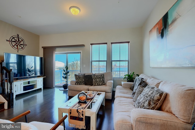 living room with a wealth of natural light and wood finished floors