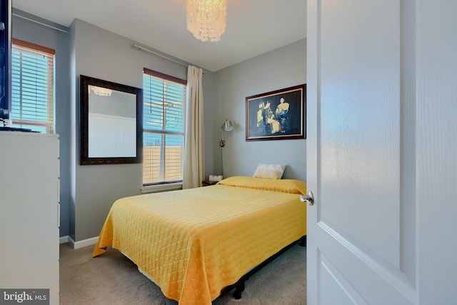 carpeted bedroom with baseboards