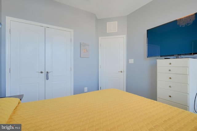 unfurnished bedroom featuring a closet and visible vents