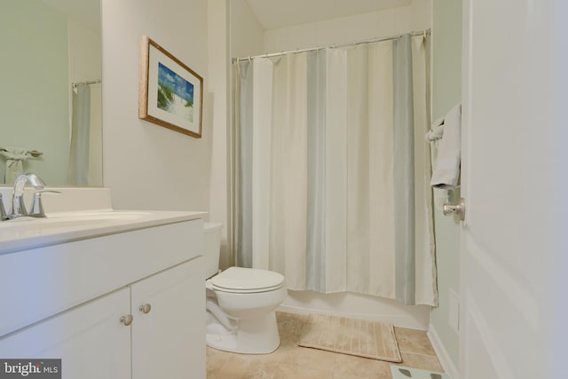 bathroom featuring toilet, tile patterned floors, shower / bath combination with curtain, and vanity