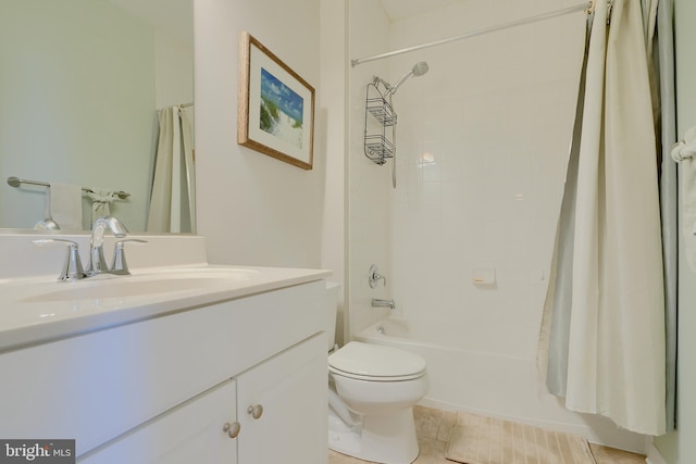 full bath featuring shower / bath combination with curtain, tile patterned flooring, vanity, and toilet