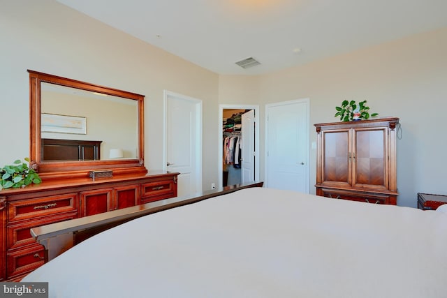 bedroom featuring visible vents