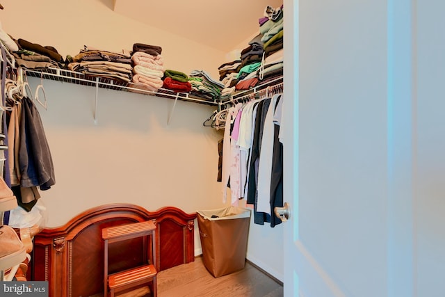 spacious closet with wood finished floors