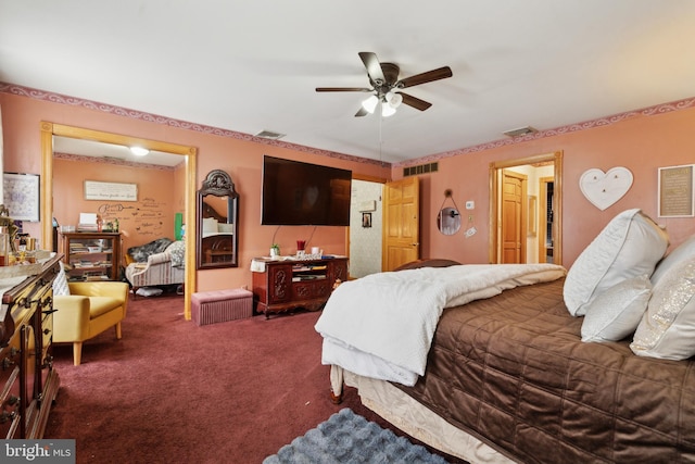 carpeted bedroom with ceiling fan and visible vents